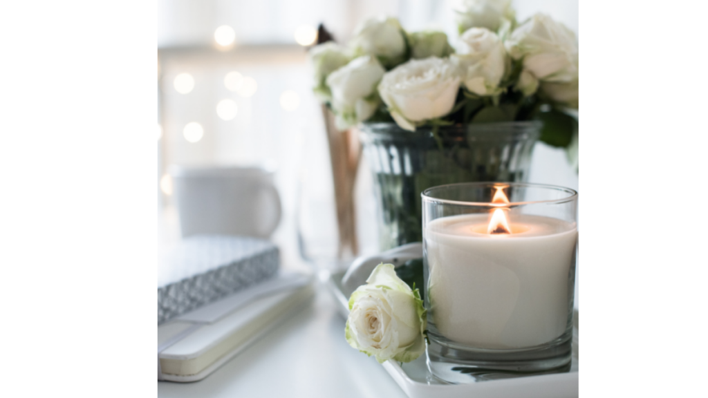 white roses and candles lit in a relaxed area