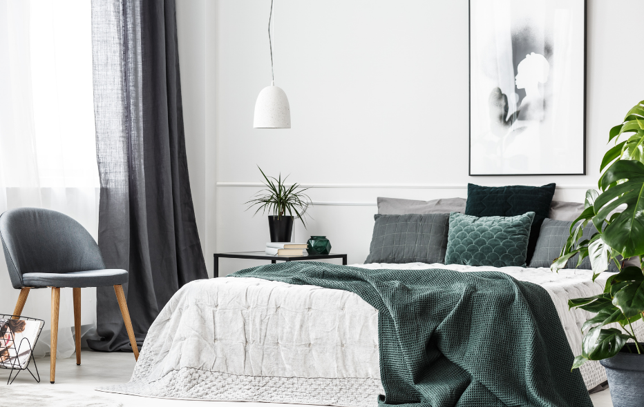 Relaxed, calm bedroom setting with green and white tones. Going to a room that's inviting and clam to sleep in has an impact on a prodcutive day.