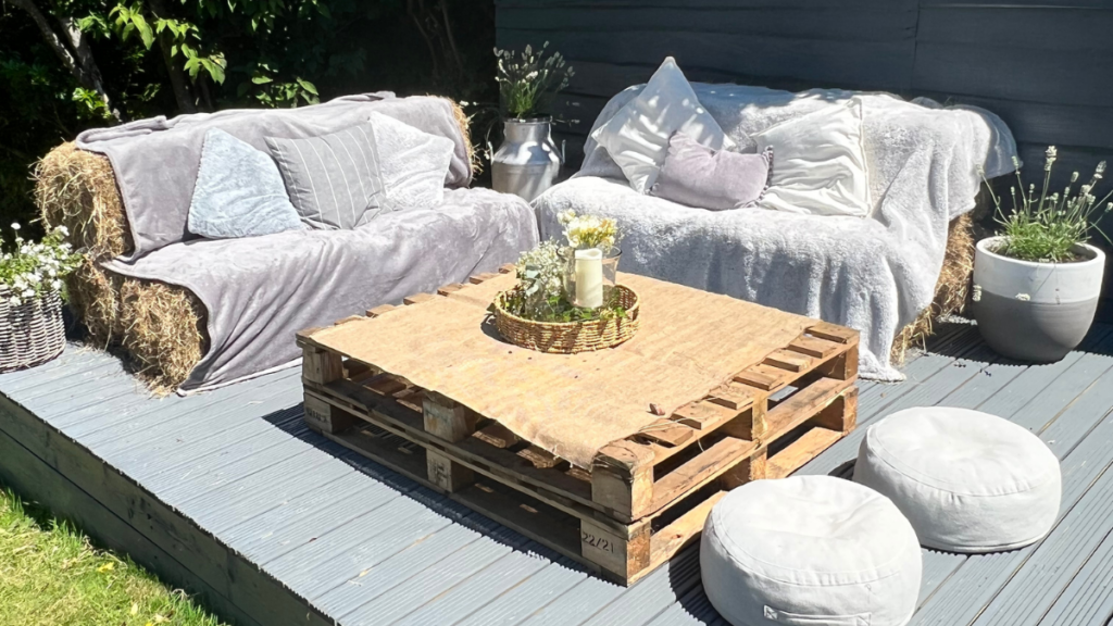 image of an l shaped sofa made of hay bales with a coffee table