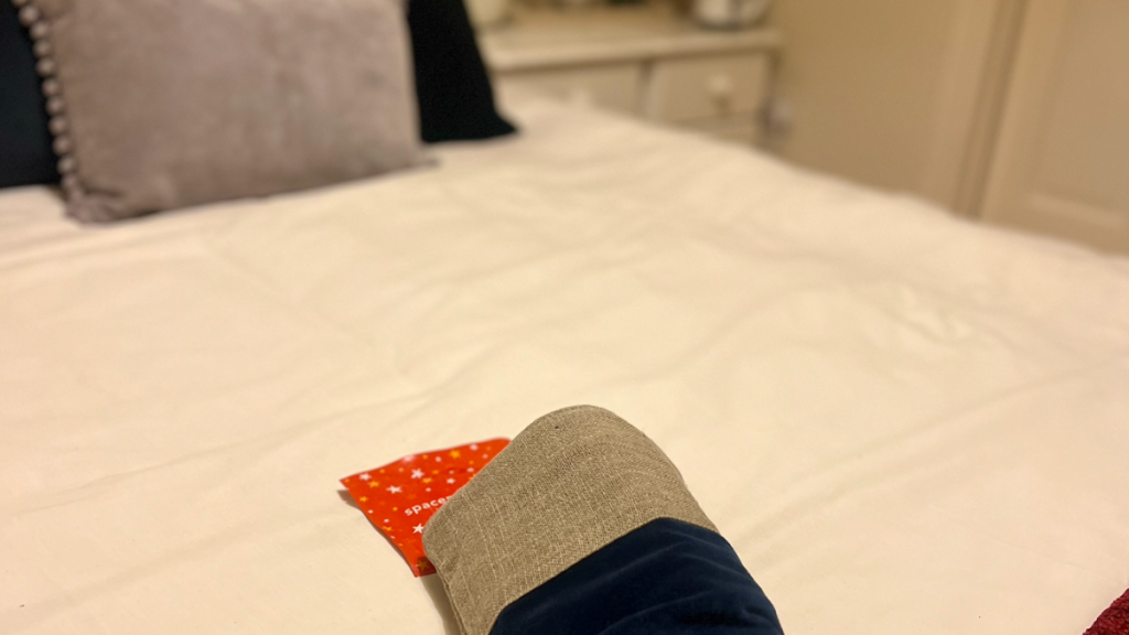 festive guest room with stocking and spacemask